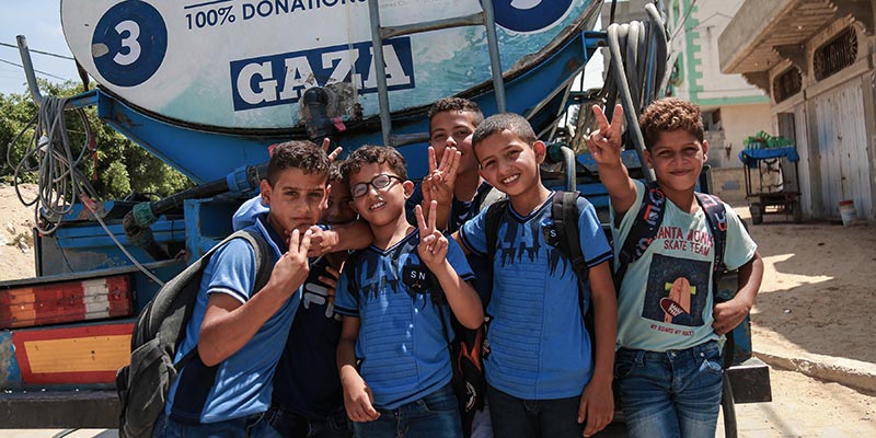 Distributing Water to Children in Gaza