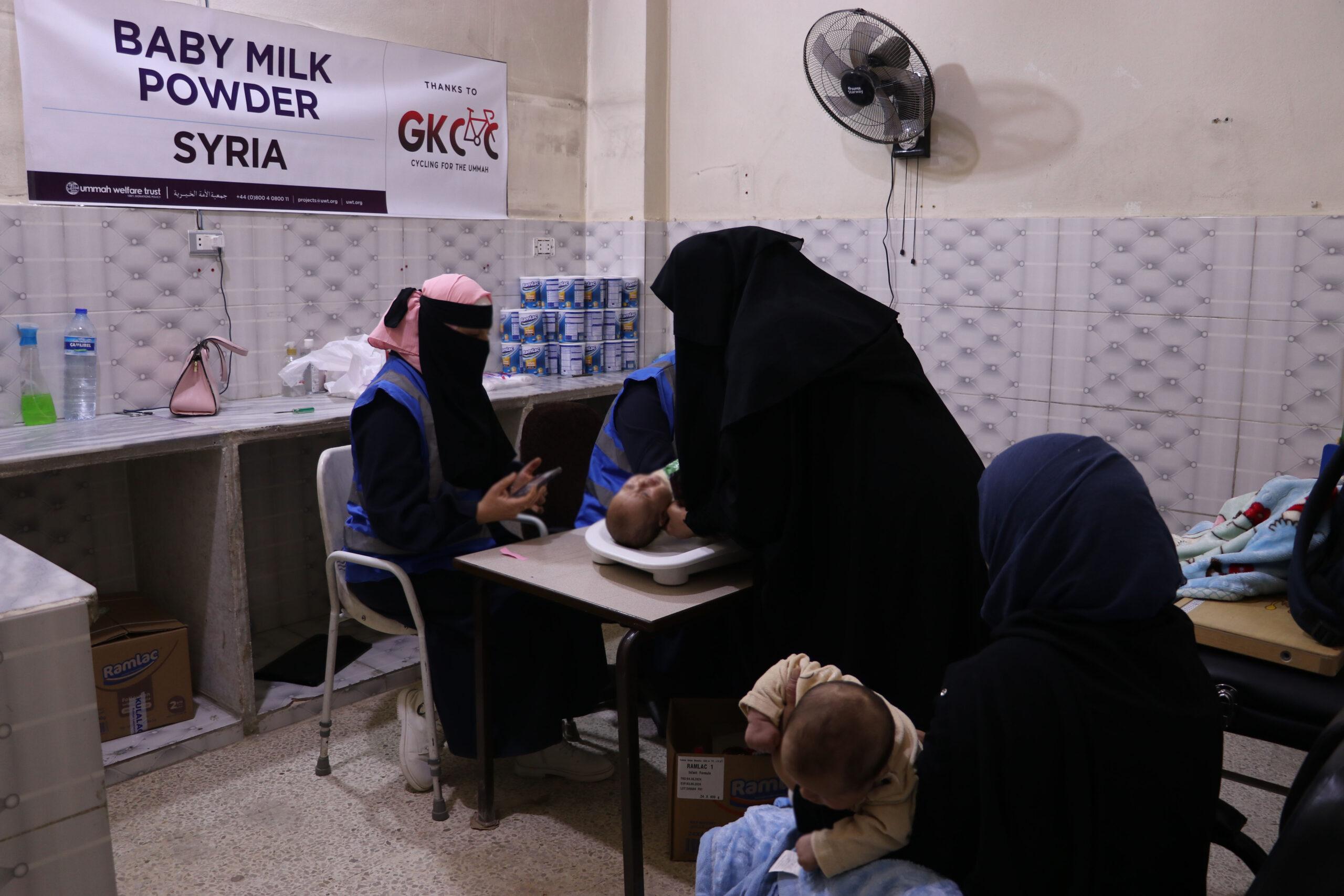 A Syrian mother caring for her young child