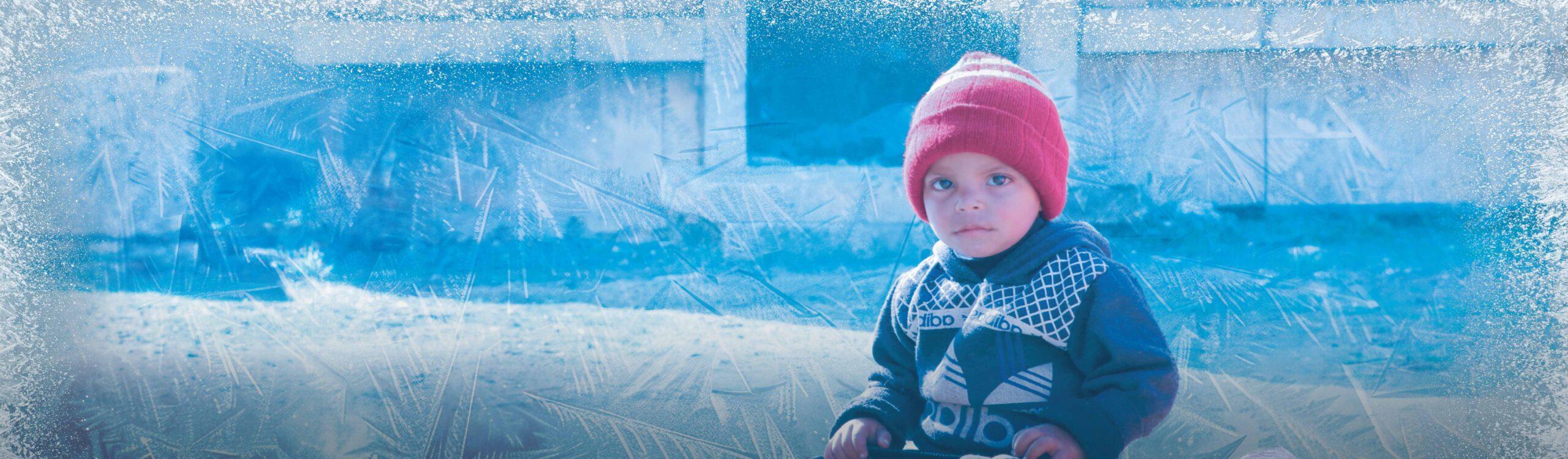 Young child facing harsh winter conditions
